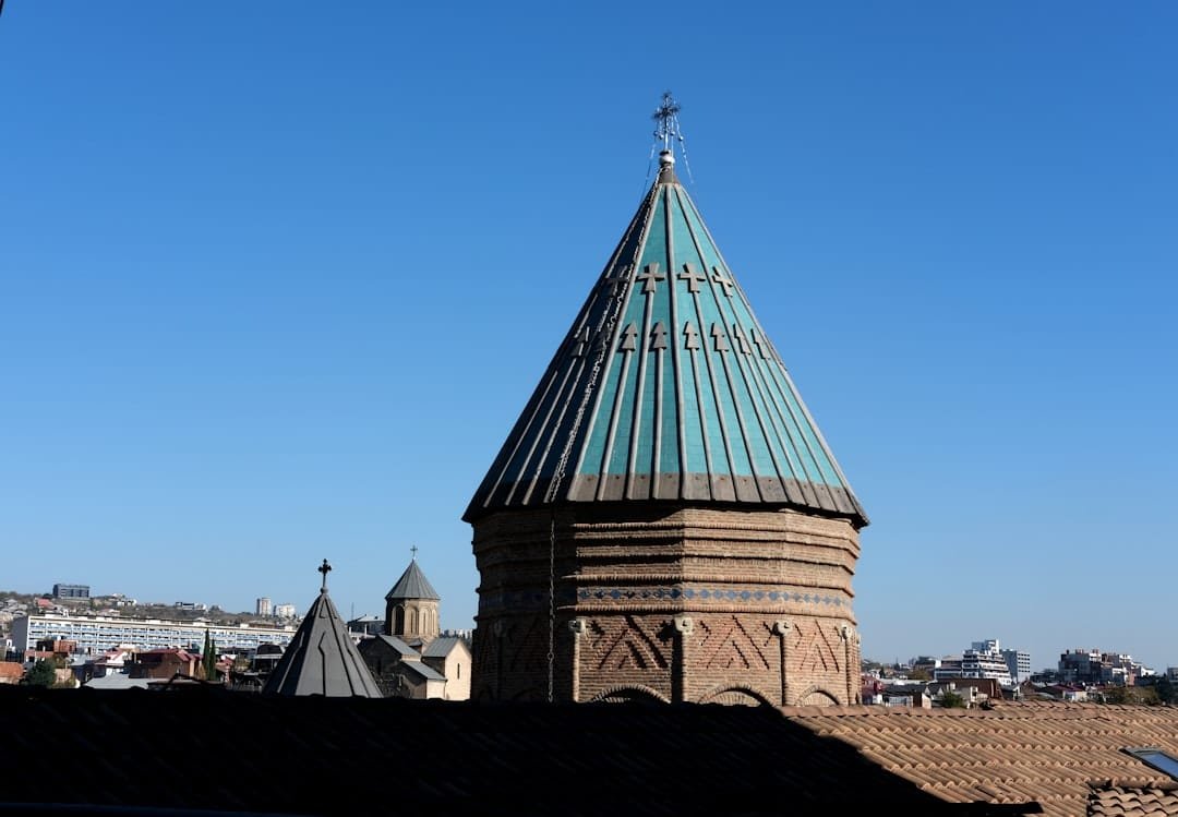 A tall tower with a clock on top of it